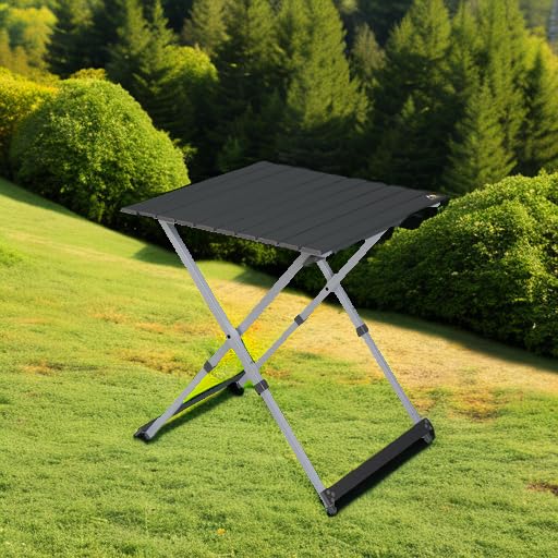 GCI Outdoor Compact Camp Table 25 folded with carry handle for easy storage.