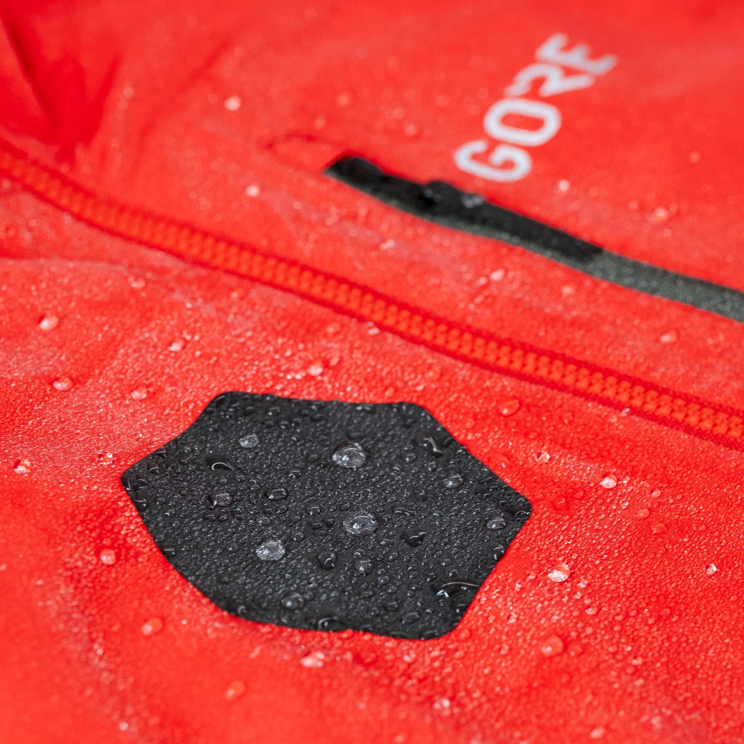GEAR AID jacket repair patch used in rugged outdoor conditions.