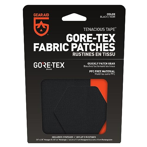 GEAR AID hex patch being pressed onto fabric to repair a jacket tear.