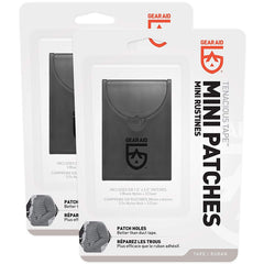 GEAR AID Tenacious Tape Mini Patches applied on a down jacket to stop feather leaks.