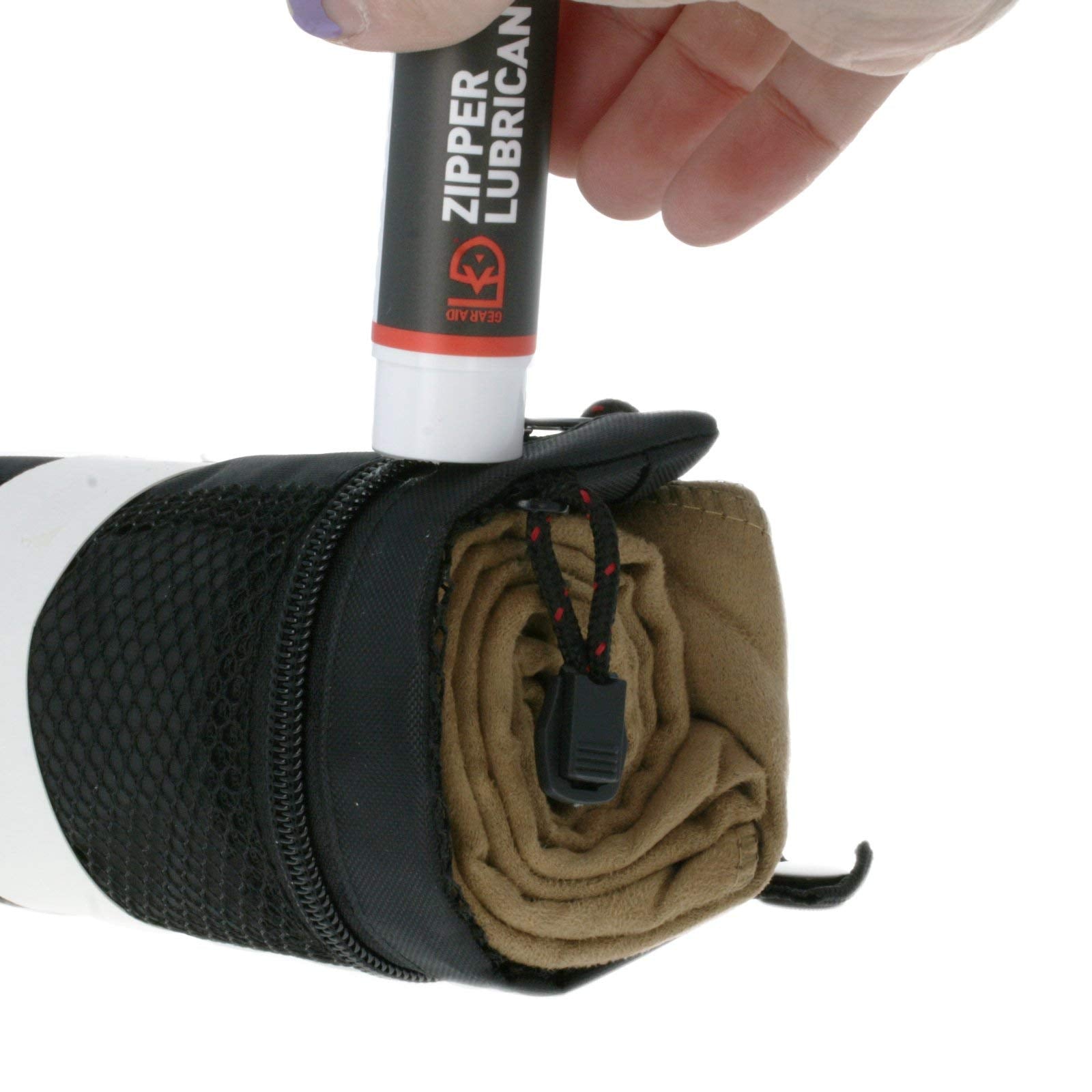 GEAR AID Zipper wax application on gear demonstrates quick glide and protection.