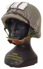 Gearbox 101st Airborne helmet display on stand for authentic military decor.