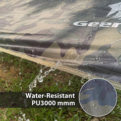Geertop rain fly shelter over a tent creating a dry cooking or seating area