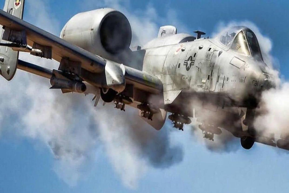Office display setup featuring General Dynamics A-10 Warthog 30mm dummy round