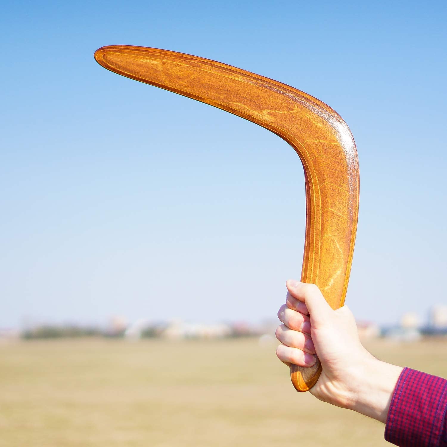 Generic boomerang showing 100-yard flight range for confident long throws.