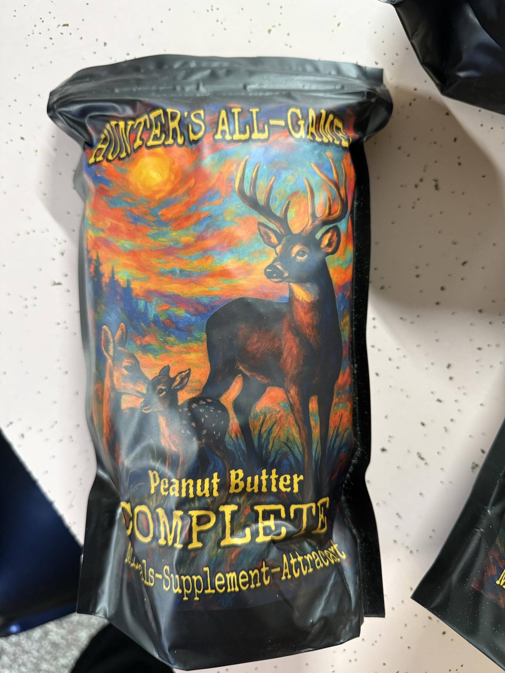 Generic Hunters All Game Peanut Butter Complete used with spin/gravity feeders for steady deer presence.