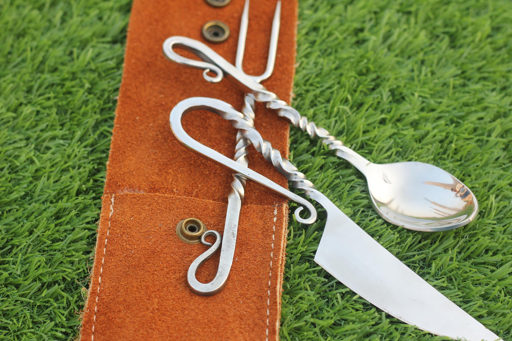 Leather pouch keeps cutlery organized for outdoors.