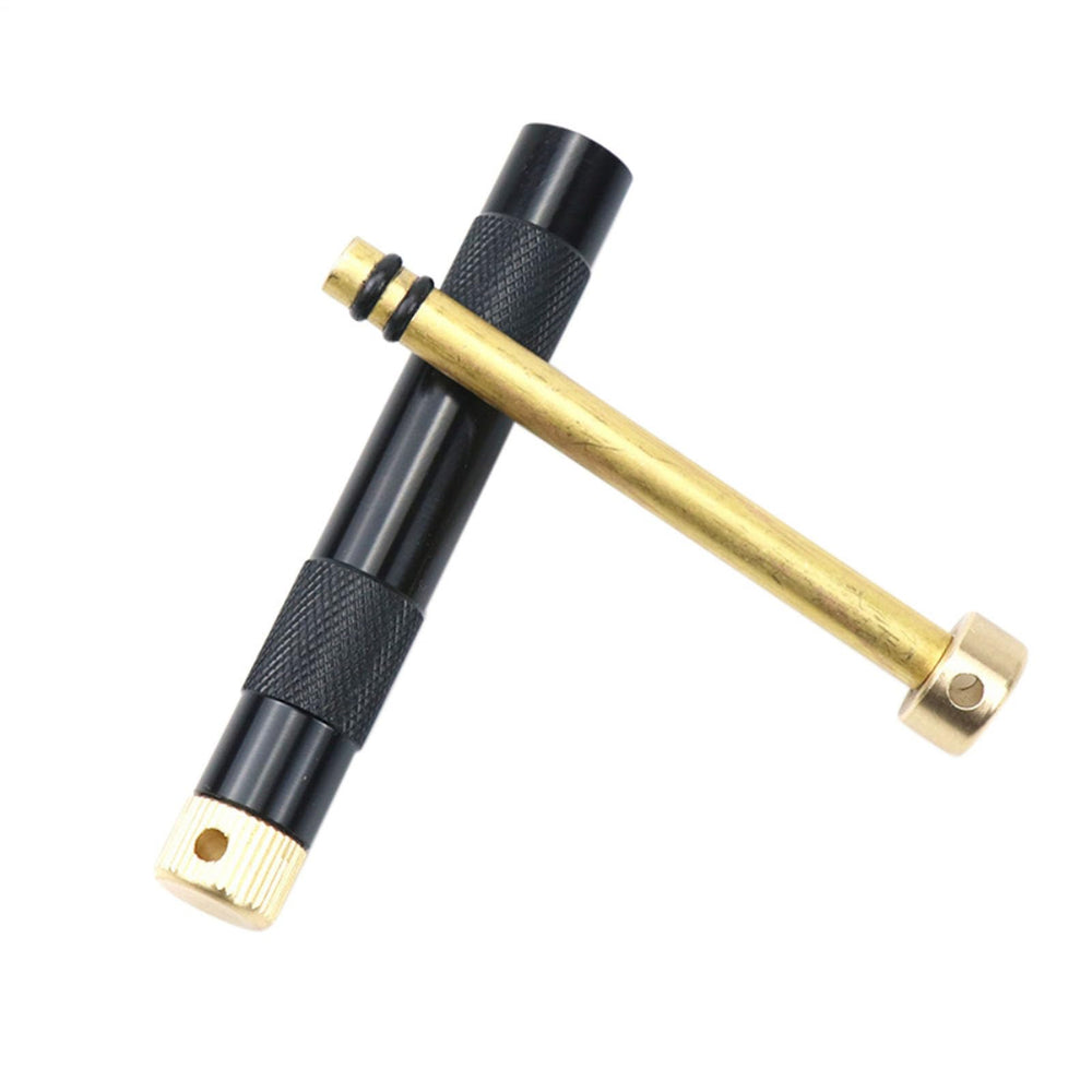 Generic Metal Fire Piston in basic setup ready to ignite tinder.