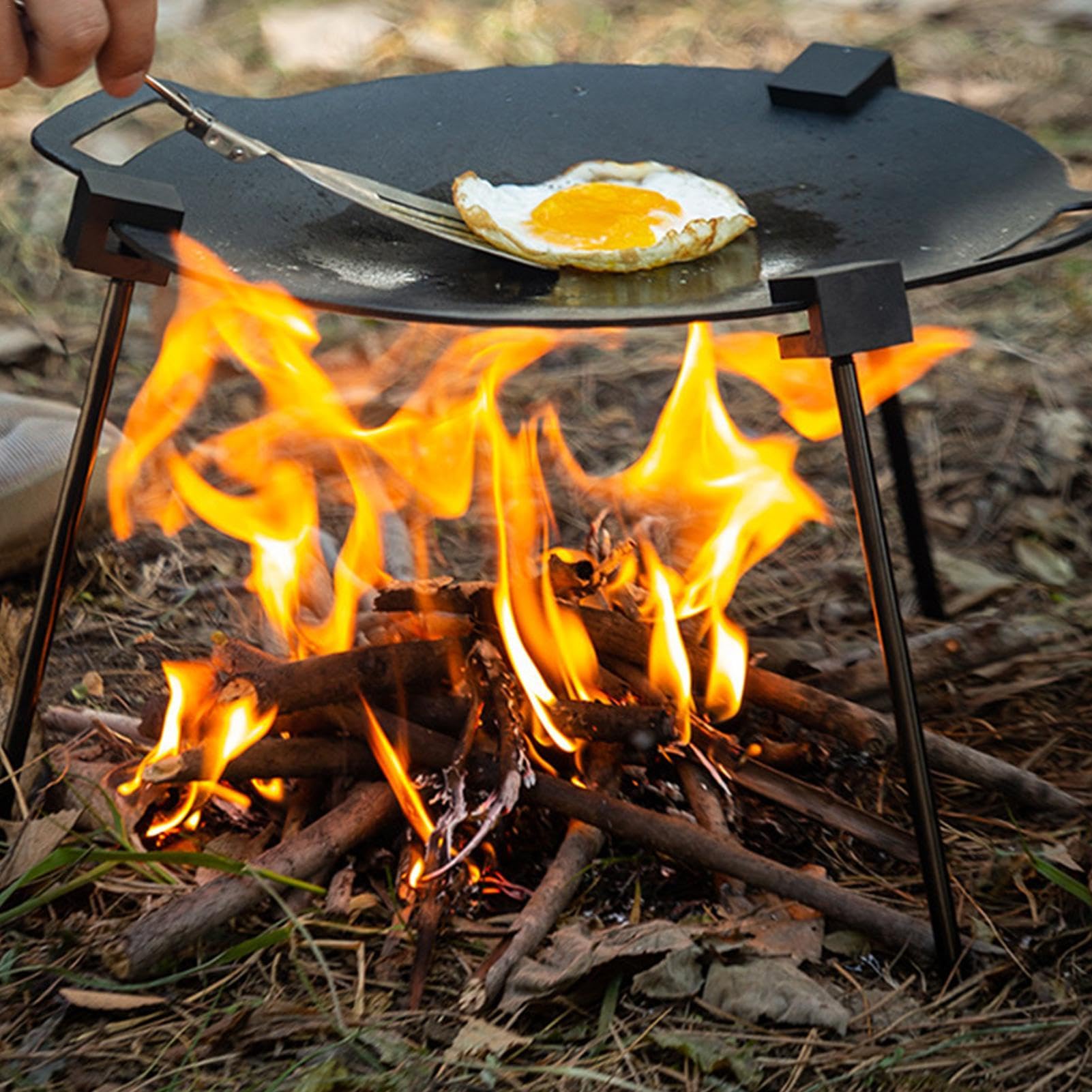 Generic tripod adjustable-height-chain offers precise flame distance during outdoor cooking.