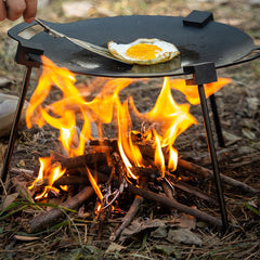 Generic tripod adjustable-height-chain offers precise flame distance during outdoor cooking.