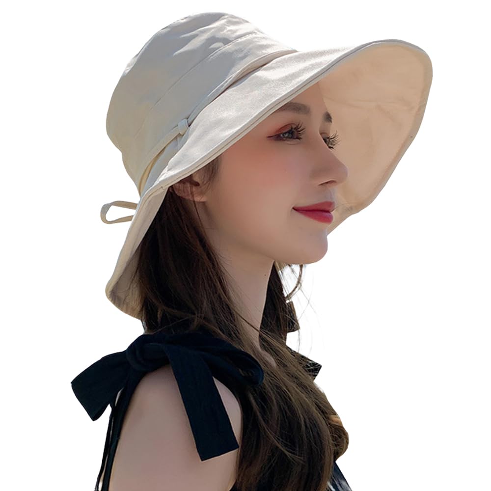 Generic Women’s Cotton Bucket Hat with wide brim shading the face on a sunny beach