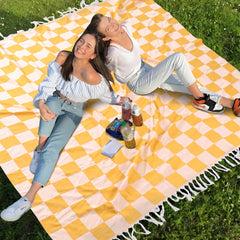 Genovega large picnic blanket on park grass, versatile for picnics and lounging.