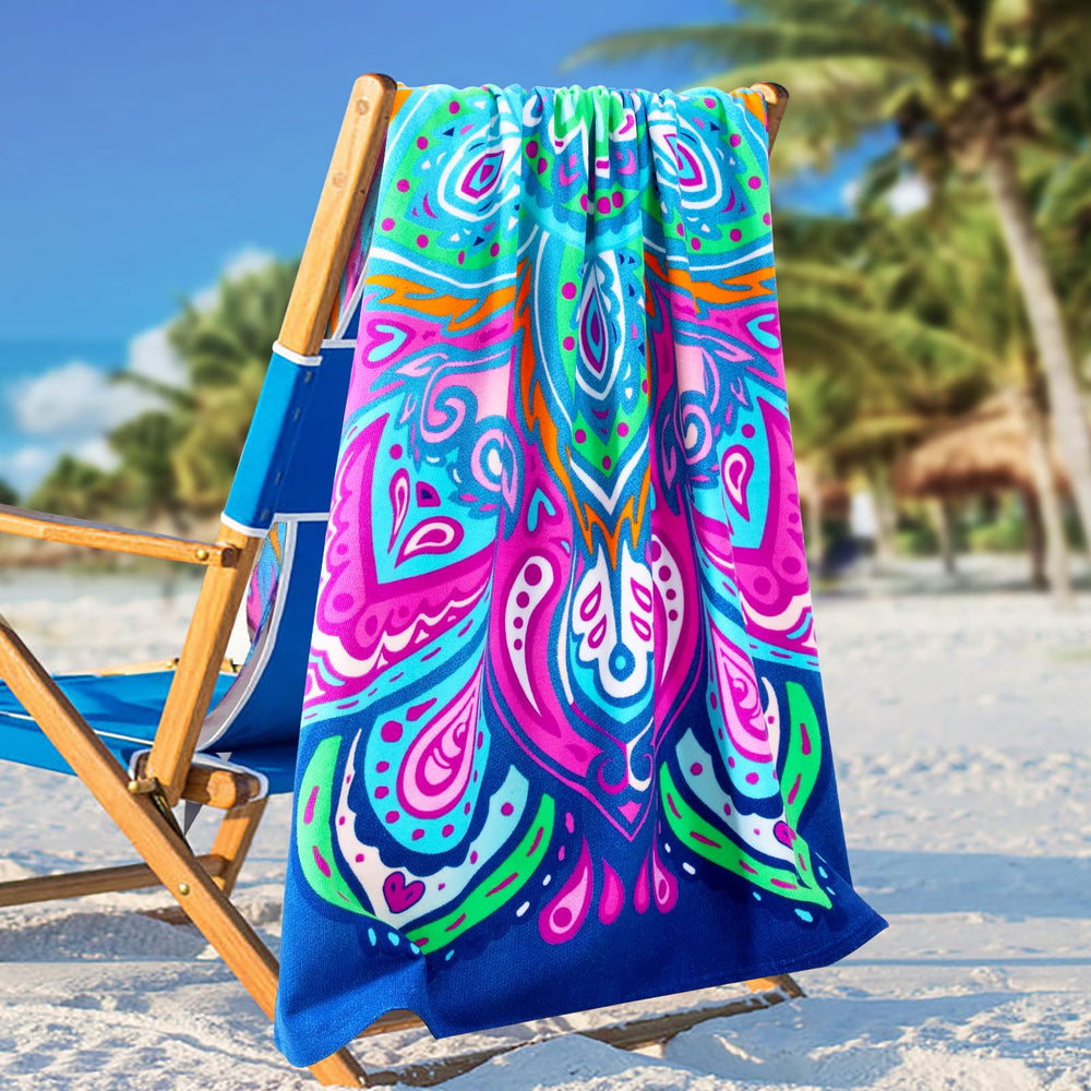 Genovega navy towel with fish-blue vortex print for poolside drying and sunbathing.