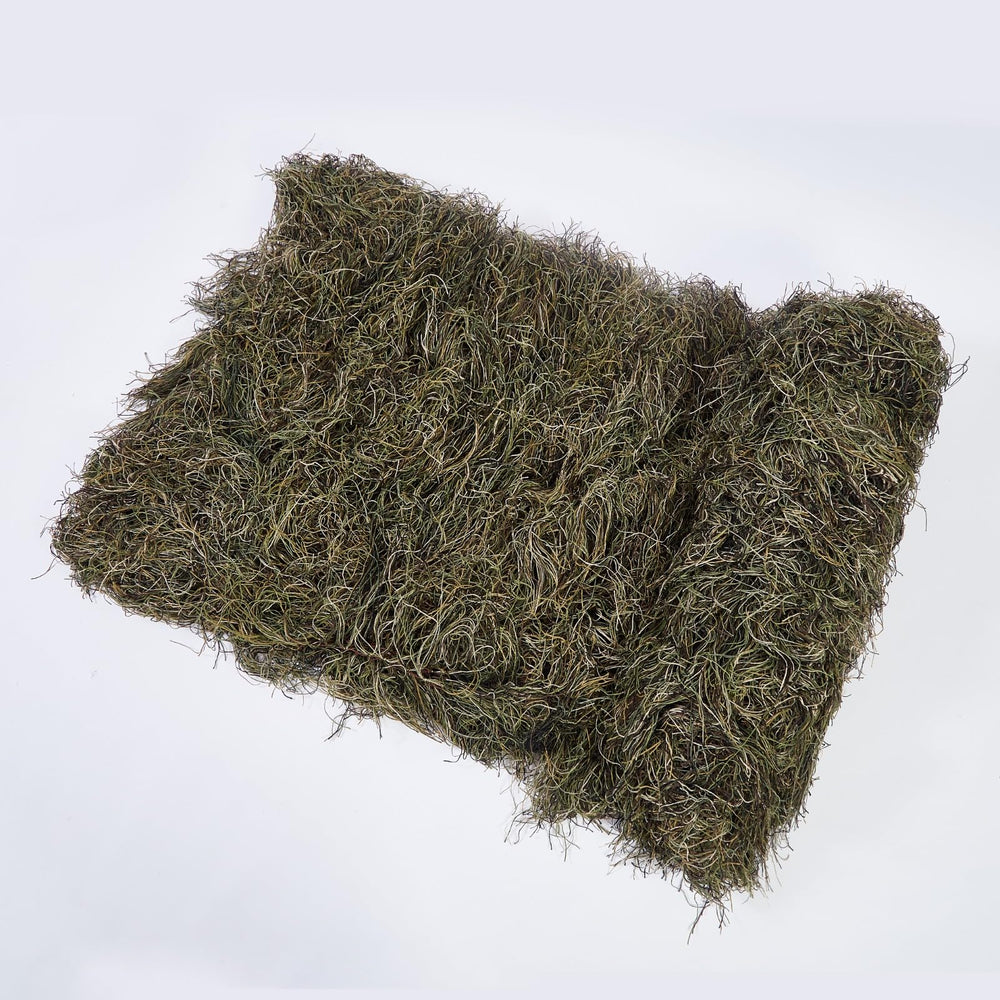 Ghillie Suits Blanket laid on ground blends with leaves and twigs.