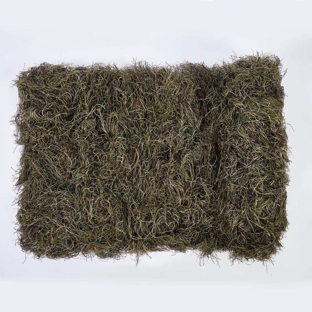 Ghillie Suits Blanket draped over a tree stand enhances concealment.