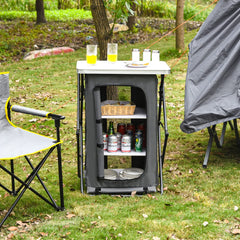 Giantex folding cabinet with 3 shelves inside keeps kitchen essentials organized during picnics.