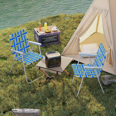 Giantex blue chair in use at a picnic, showing back tilt and armrests