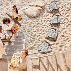 Giantex steel-frame director chair shown at the beach for sturdy comfort.