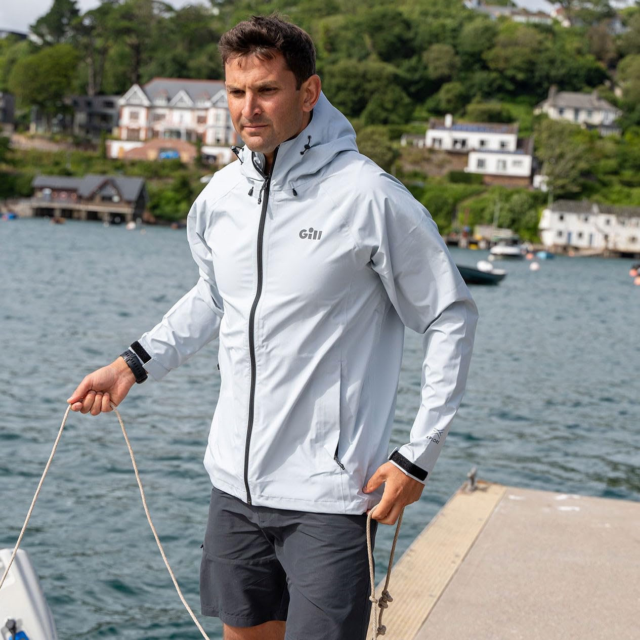 Gill Voyager Rain Jacket hood up demonstrates adjustable protection against unpredictable weather.