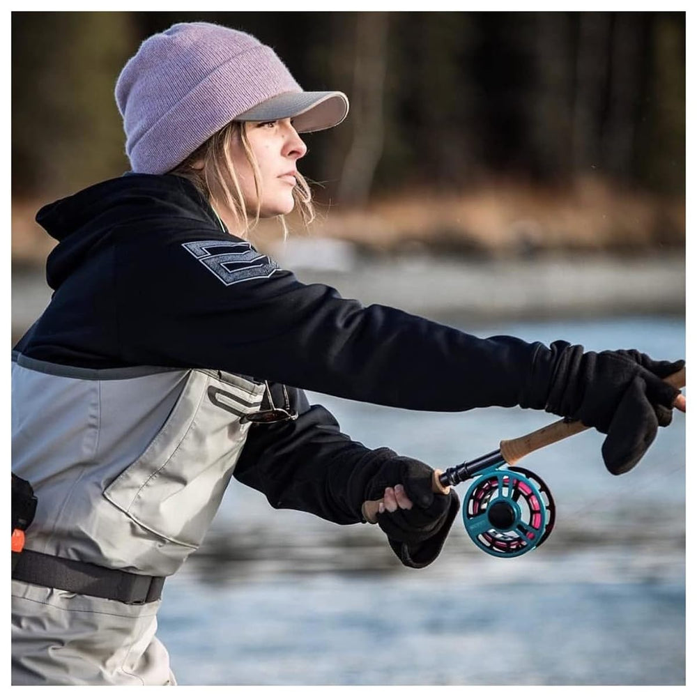 Glacier Glove Alaska River Flip Mitt in use with touchscreen devices.