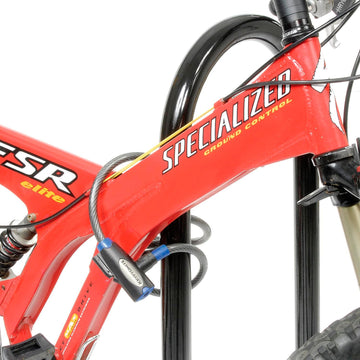 Global Industrial 41-inch Wave Bike Rack base-mounted for secure anchoring