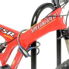 Global Industrial 41-inch Wave Bike Rack base-mounted for secure anchoring