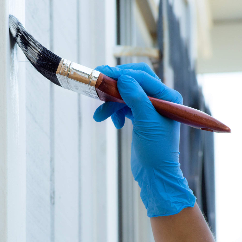 Gloveworks blue nitrile gloves suitable for food service and cleaning duties.