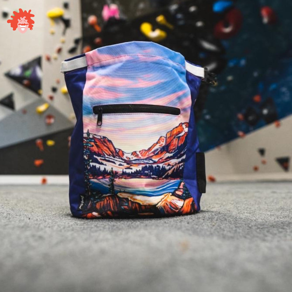 Gnarly Dood Rocky Mountains chalk bucket exterior features brush holder and pockets for gear.