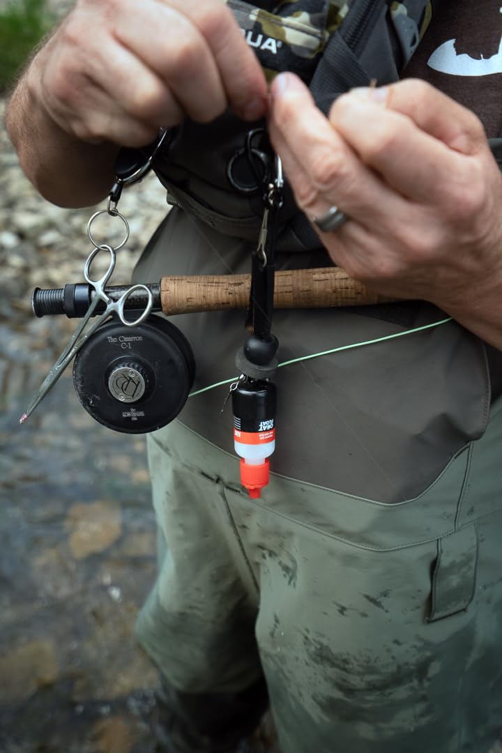 Close-up of Goat Floatant being applied to a dry fly