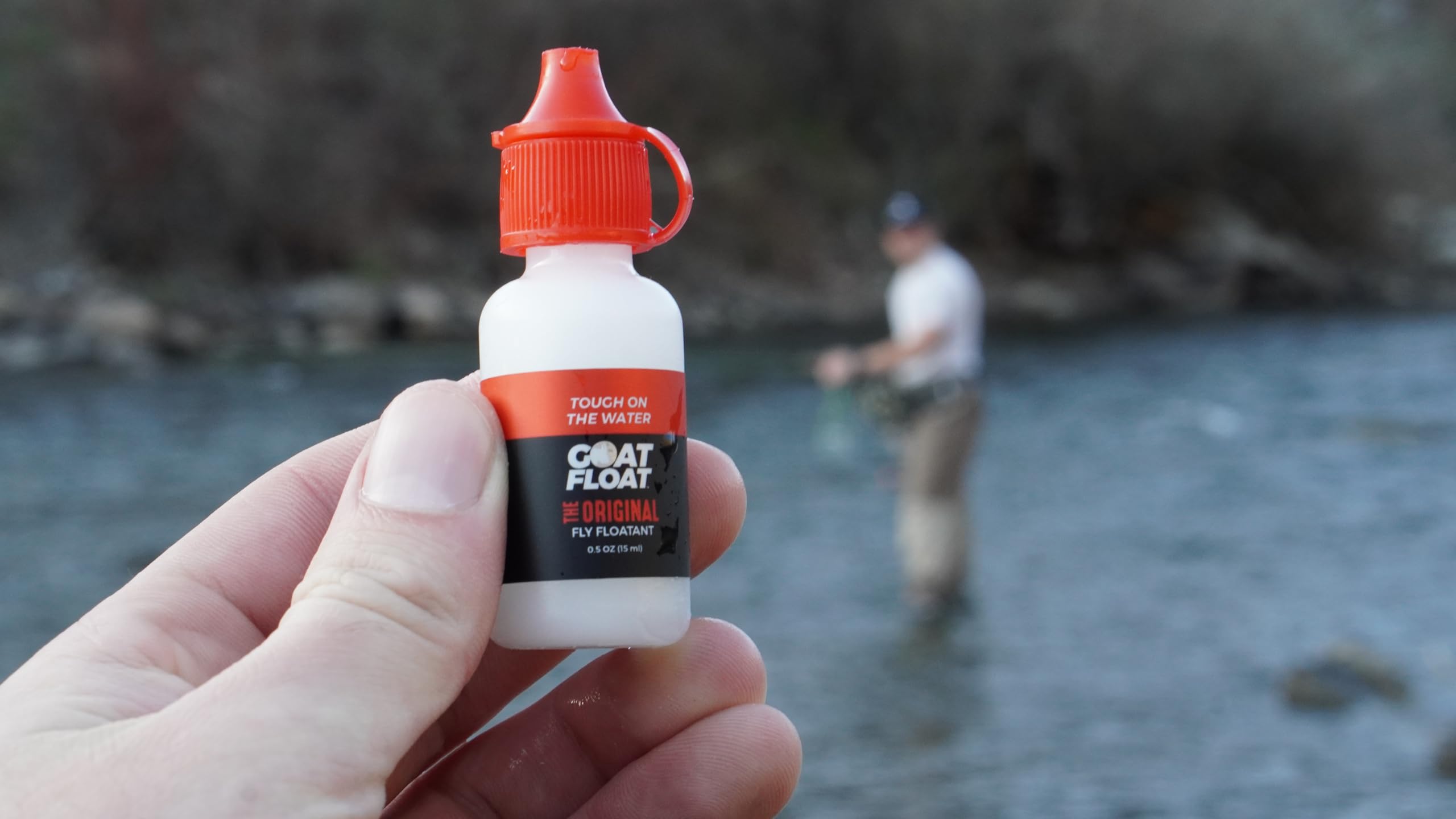 Fly fishing scene with a dry fly on water featuring Goat Floatant