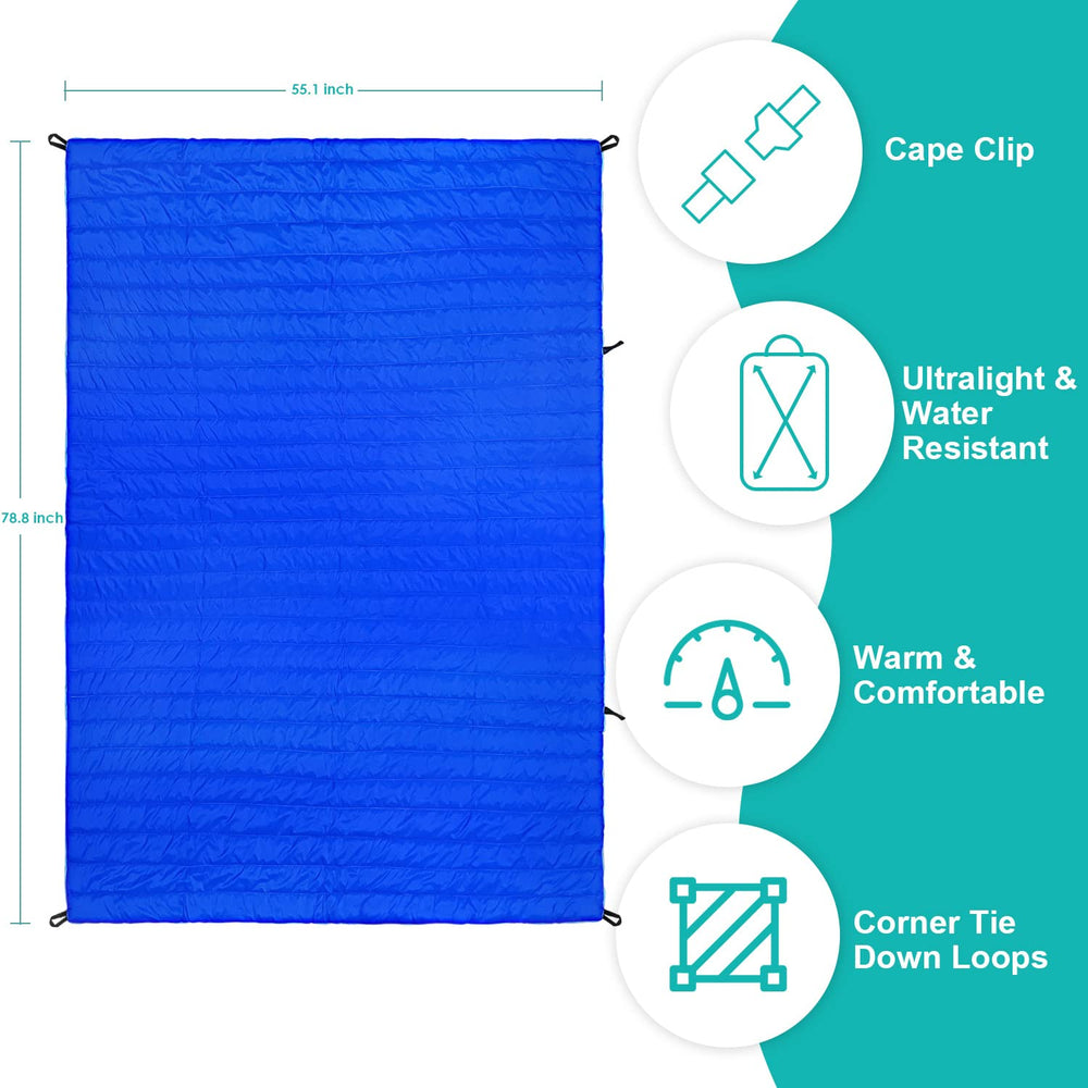 Gold Armour camping blanket blue at the beach offering warm coverage and sand protection.