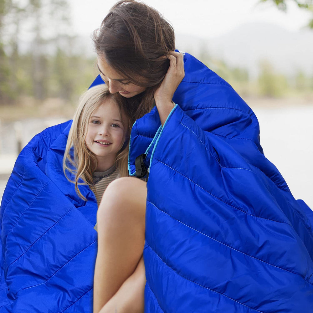Gold Armour camping blanket blue with corner loops keeps it in place on uneven ground.