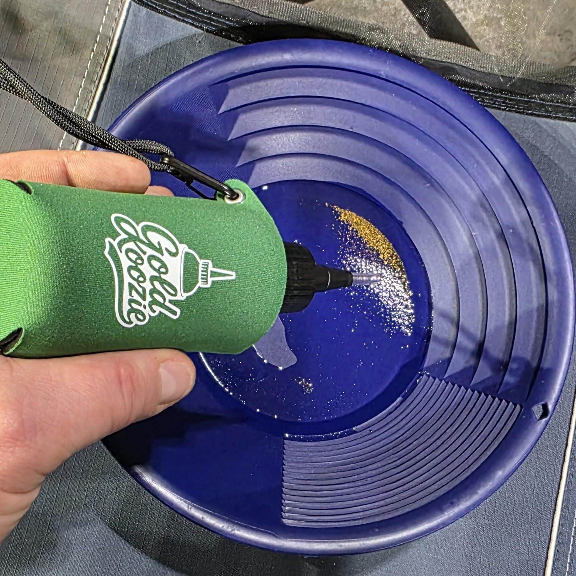 Gold Koozie sleeve features durable grommets for outdoor use.