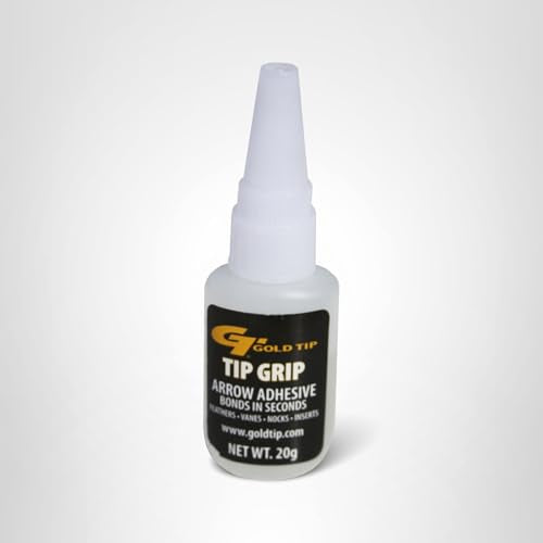 Closeup of Gold Tip Tip Grip adhesive in use to secure vanes on a carbon arrow