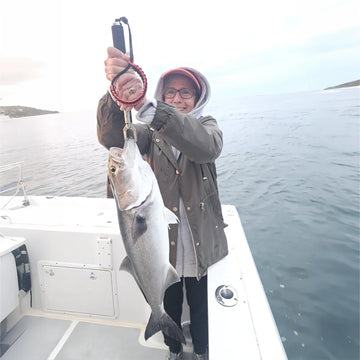 Inshore fishing setup with lip gripper ready to land a fish