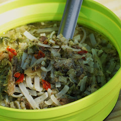 GOOD TO-GO Chicken Pho pouch being prepared with boiling water at camp