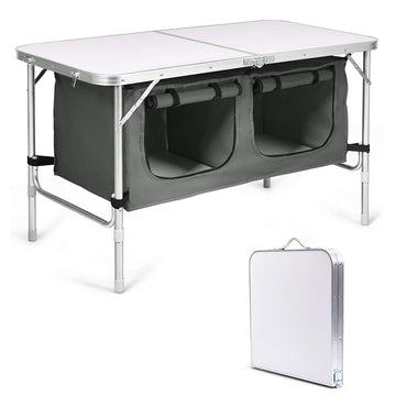 Goplus folding camping table with storage, compact when folded for easy transport and setup.