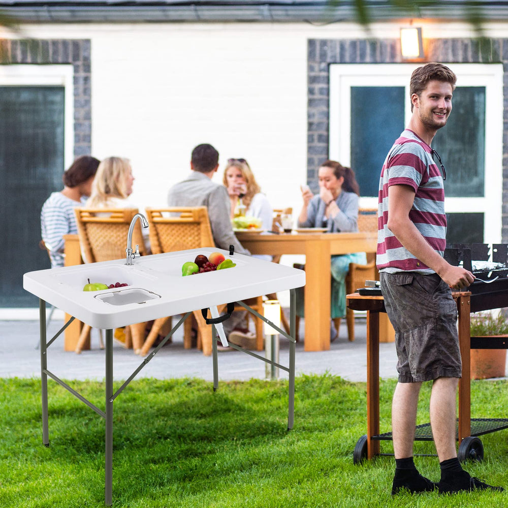 Goplus outdoor-use table supports fishing, camping, and picnics.