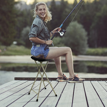 Goplus 28-inch tall stool ready for comfortable outdoor seating on uneven ground.