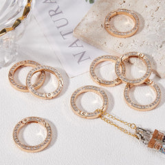 GORGECRAFT rhinestone O-ring clip attached to a handbag strap.