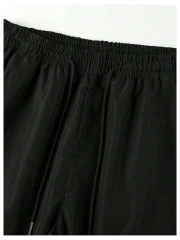 GORGLITTER boys cargo pants in black and blue showcase durable style for park and travel.