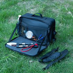 Goture tackle bag with rod straps securely hold rods during transport.