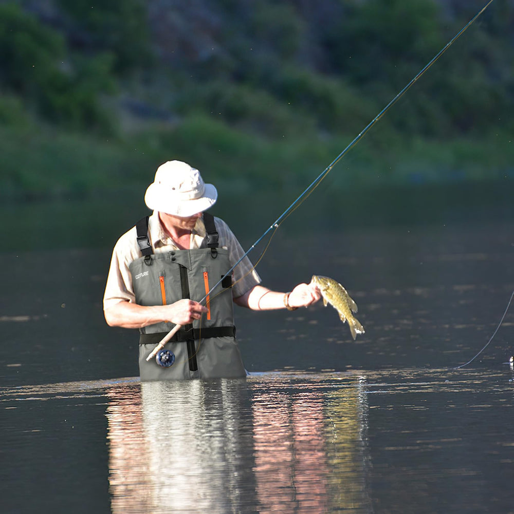 Goture stocking-foot waders with zippered pocket keep essentials safe during fishing.