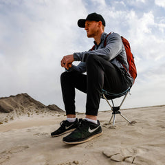GRAND TRUNK Compass 360° Stool clay red folded-state shows ultracompact packability for hikes.