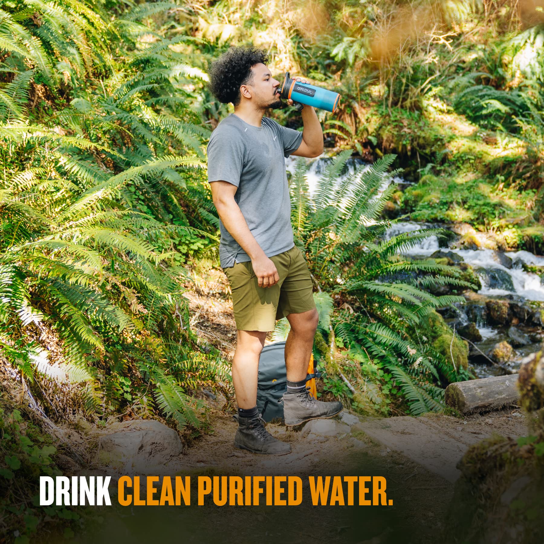 GRAYL GeoPress 24 oz Bali Blue in use during a hike conveys reliability in remote streams