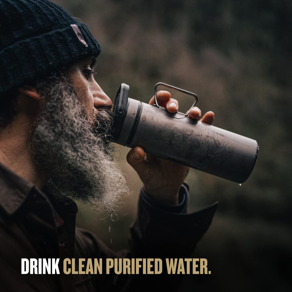 GRAYL UltraPress Titanium pours purified water after quick filtration