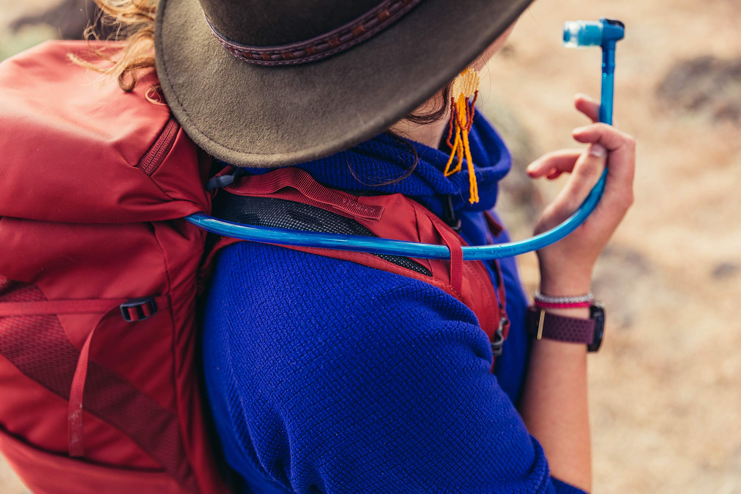Gregory Arrio 24L perforated shoulder harness with hydration routing for easy sipping on hikes