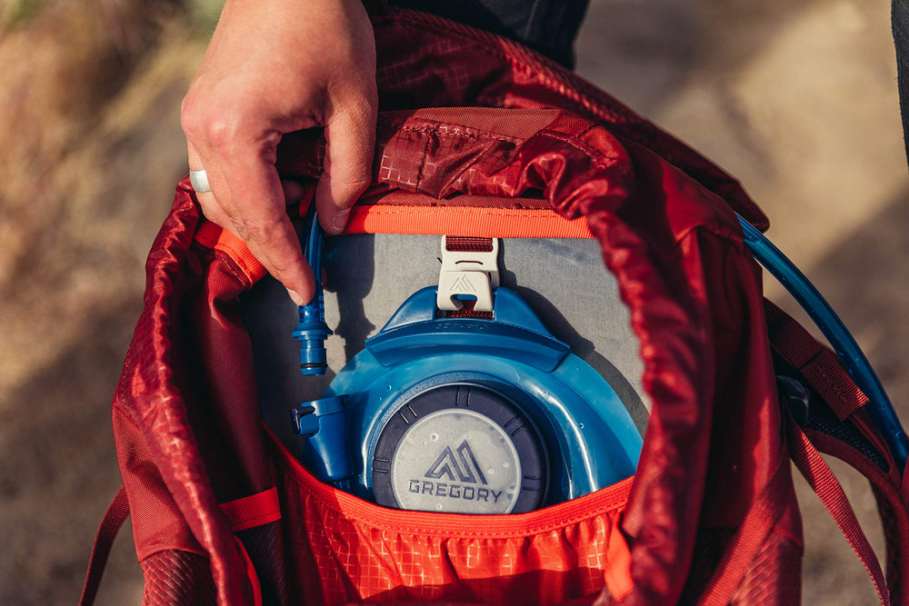 Gregory Arrio 24L side zip pocket keeps snacks handy for trails.