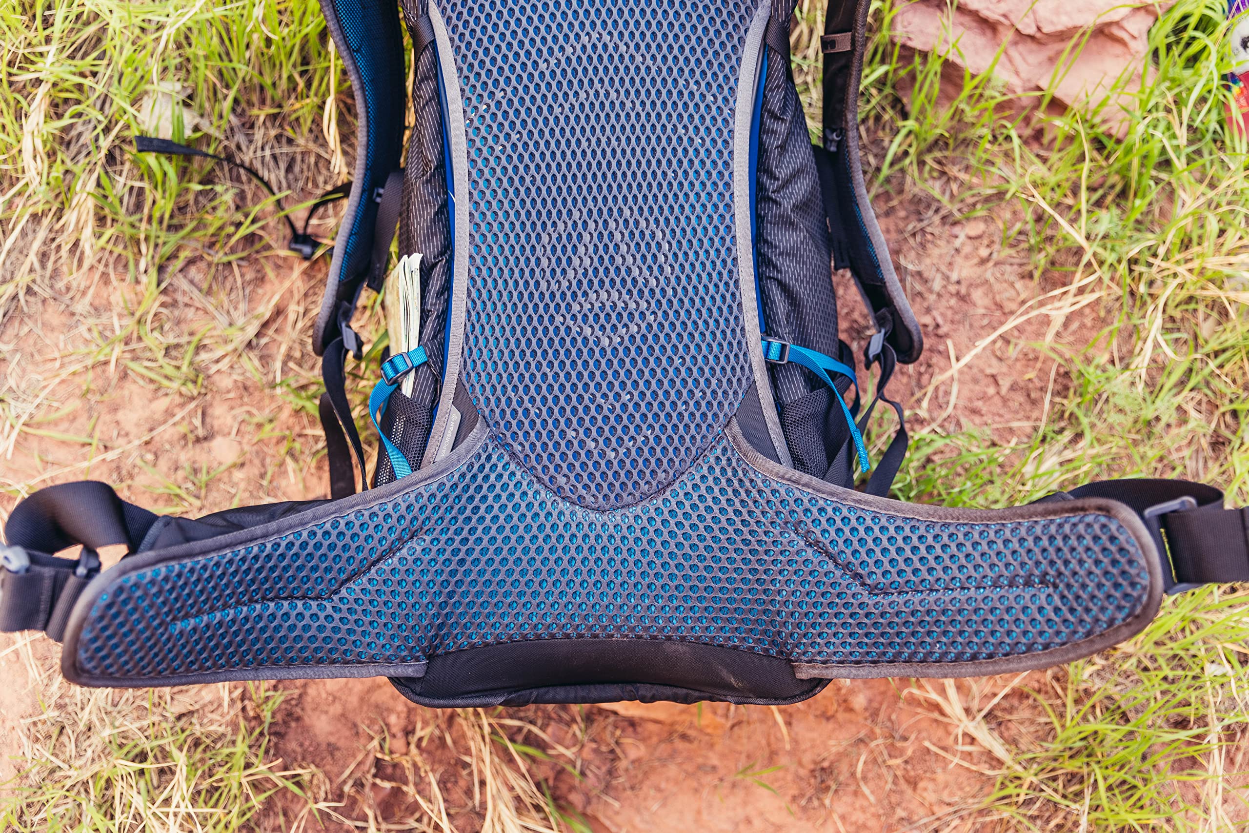 Gregory Citro 30L H2O shoulder harness with whistle in action on rugged terrain