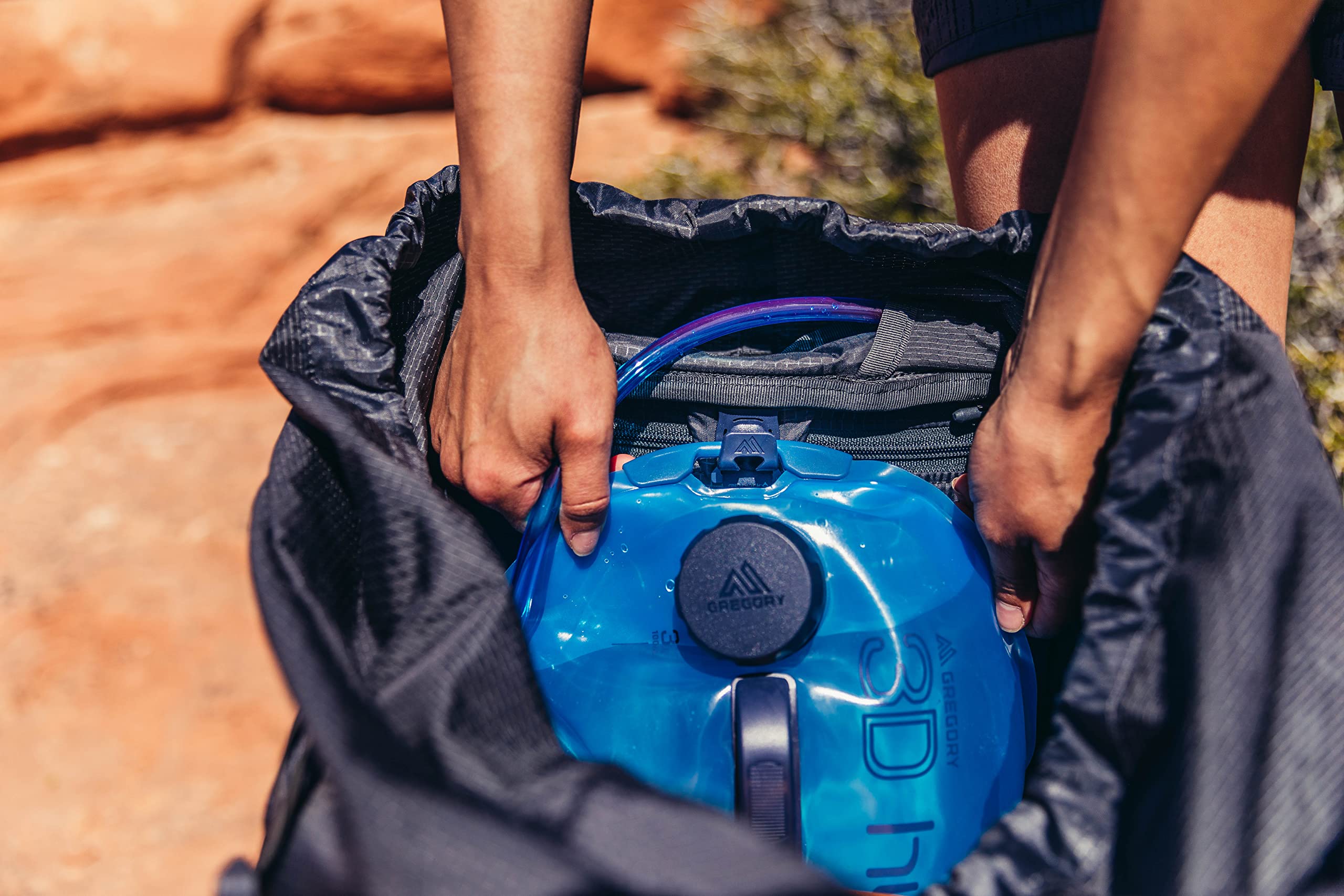 Gregory Deva 80L Pro hydration clip and safety features for on‑the‑go use.